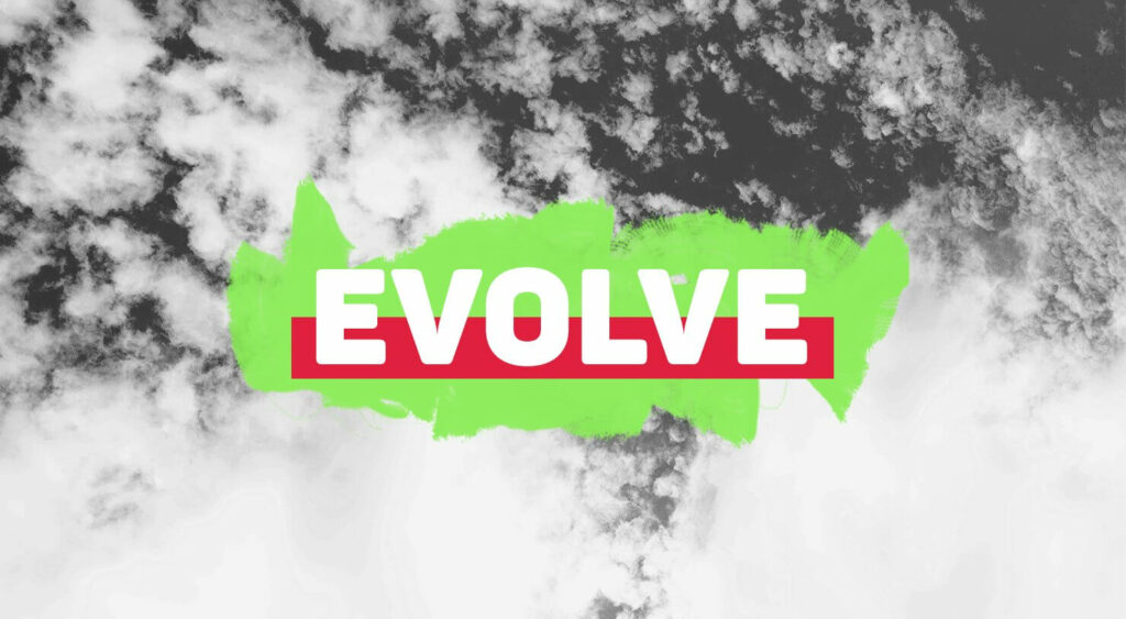 'EVOLVE' in front of a black and white cloud filled sky.