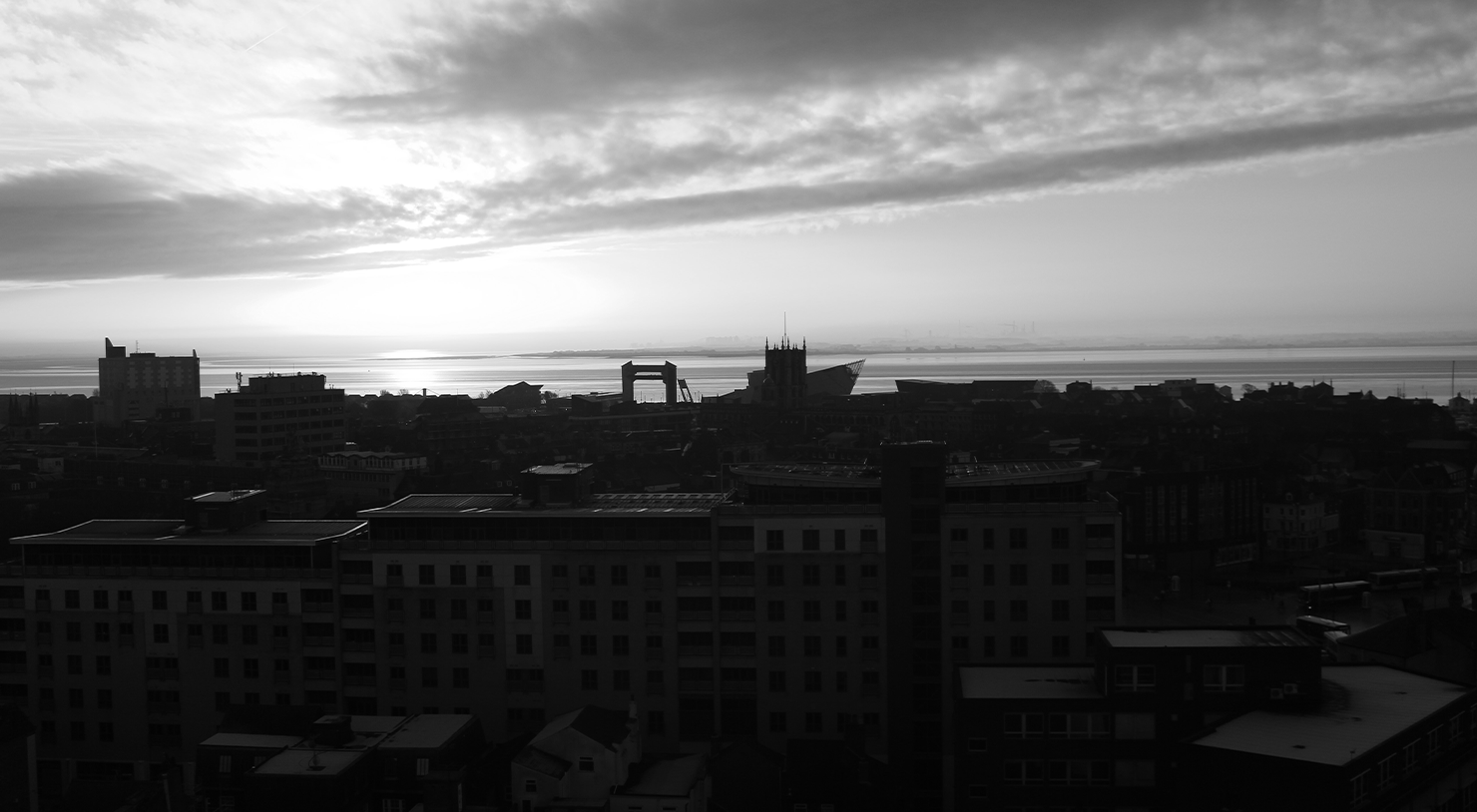 Silhouette of Hull City Centre on a morning sunrise.